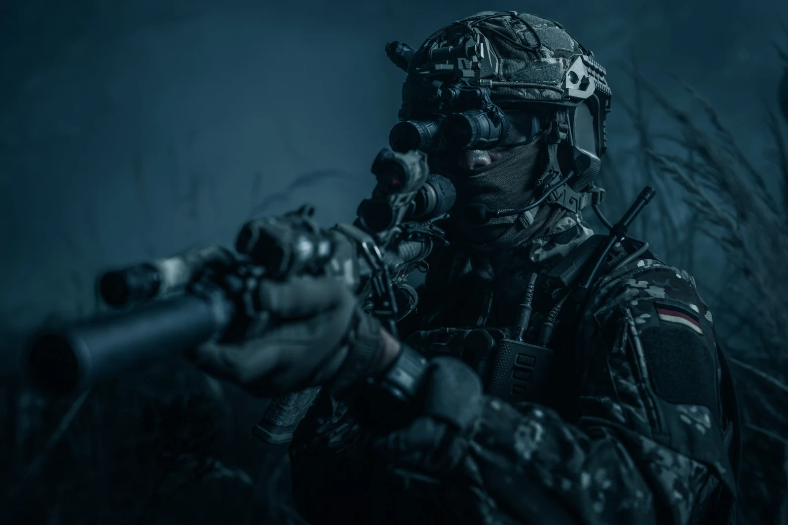 Professional operator with optical equipment in a low-light environment